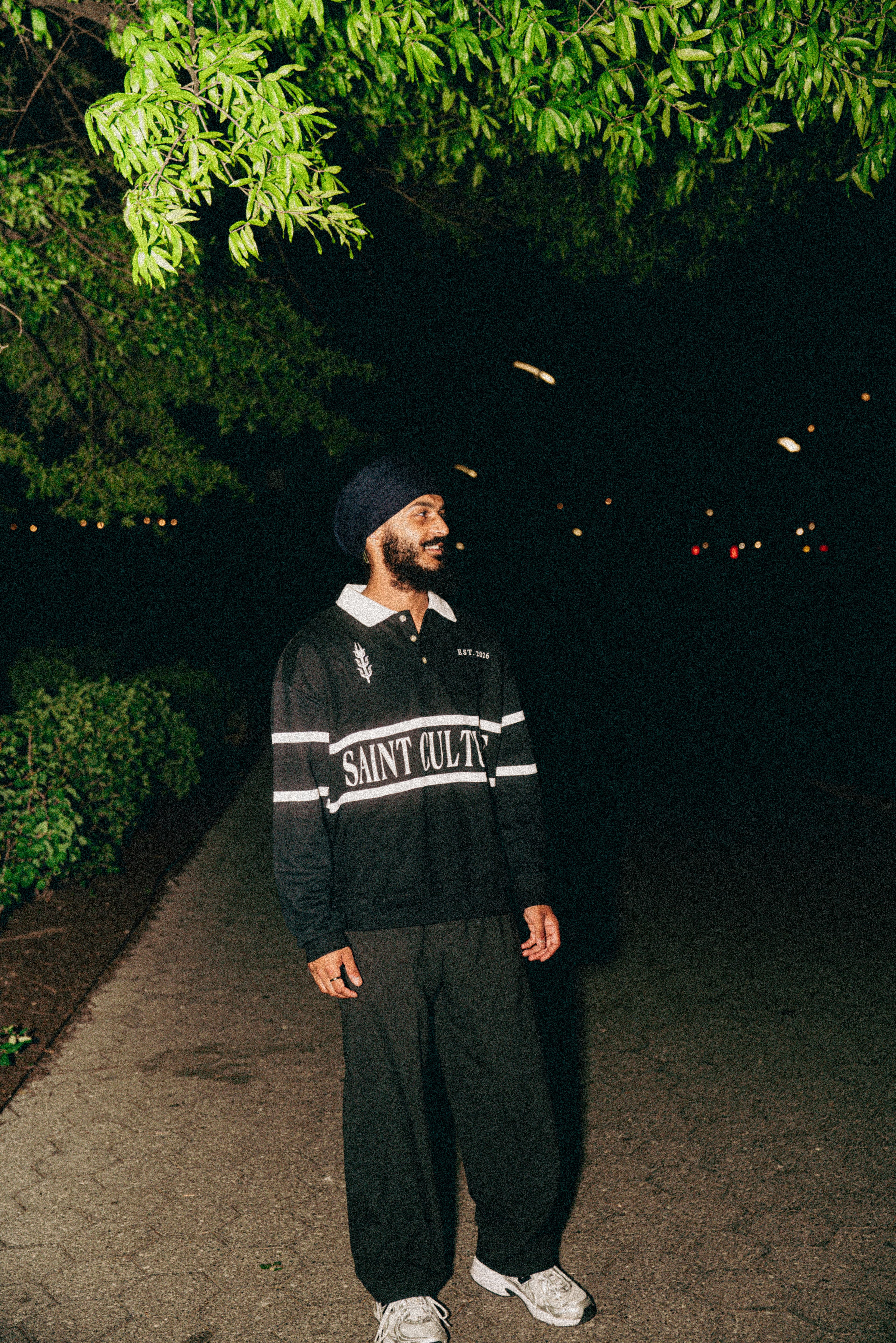 model wearing SAINT CULTURE polo.